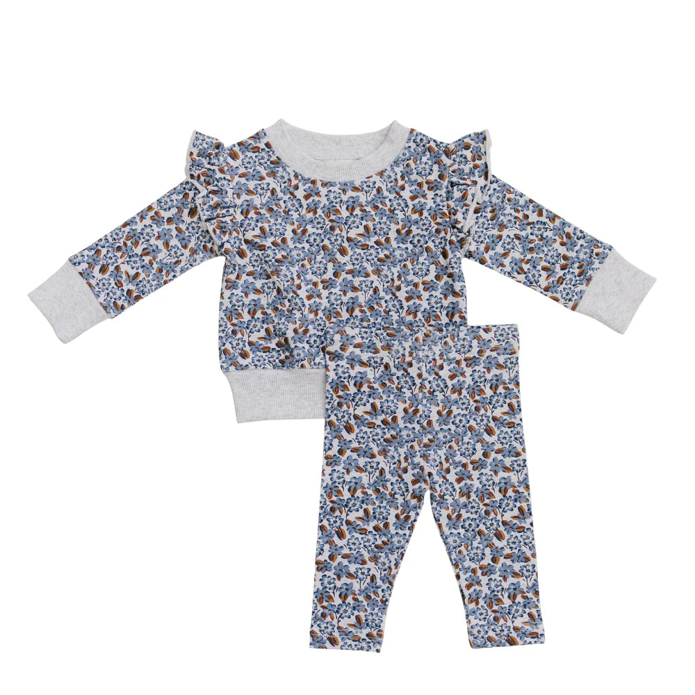 A baby two-piece pajama set featuring a long-sleeve top and matching pants with a blue, brown, and white floral pattern, finished with solid light gray ribbed cuffs and collar.