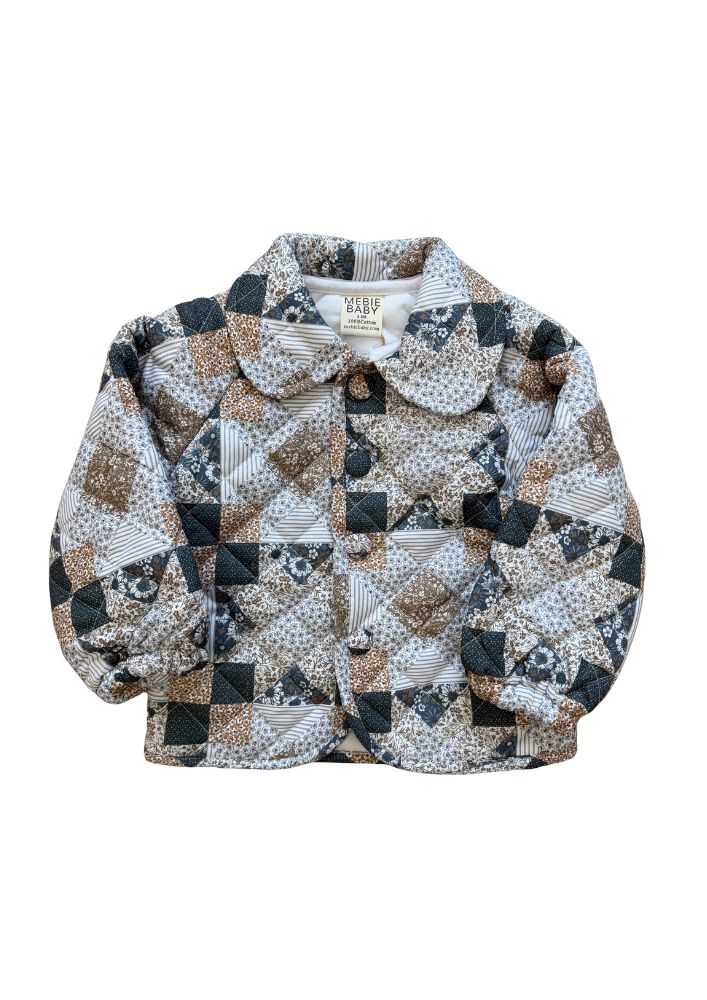 A baby quilted jacket with a patchwork design in beige, brown, dark blue, and white, featuring a Peter Pan collar and front buttons.