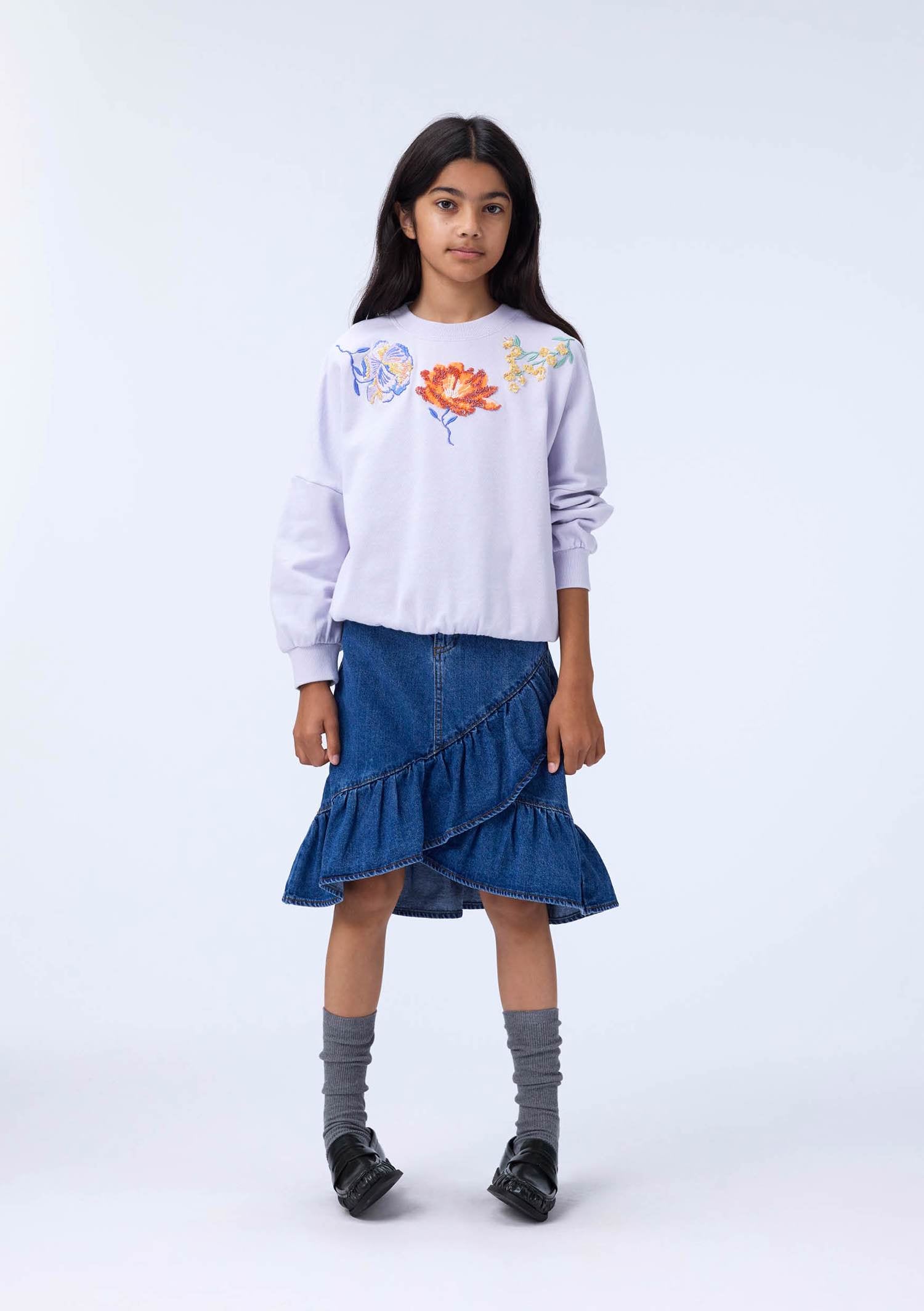 Girl in Purple Crewneck with Flowers