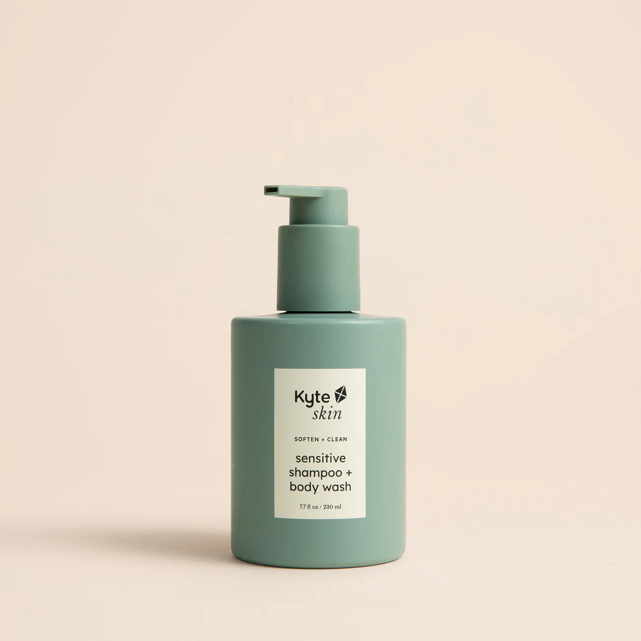 Green shampoo and body wash bottle with Kyte Skin label on a beige background