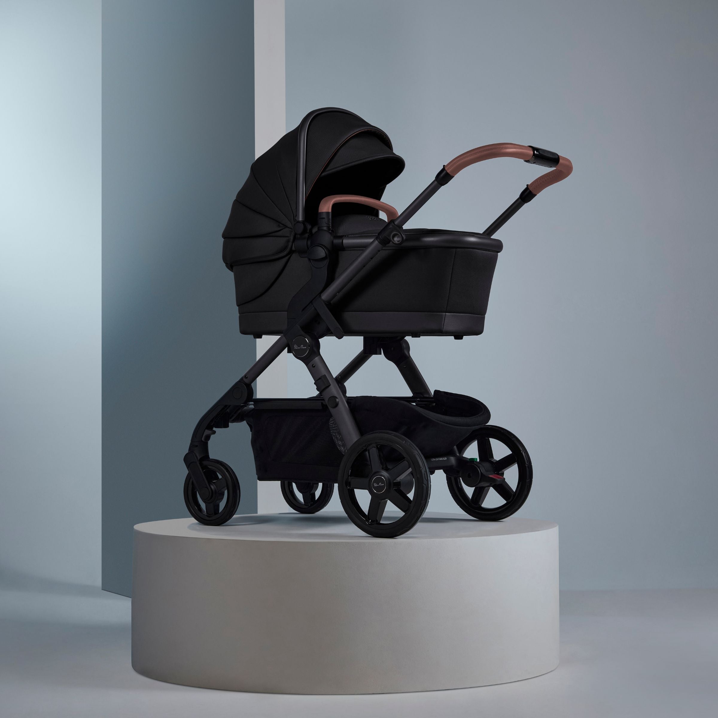 black bassinet on stroller frame