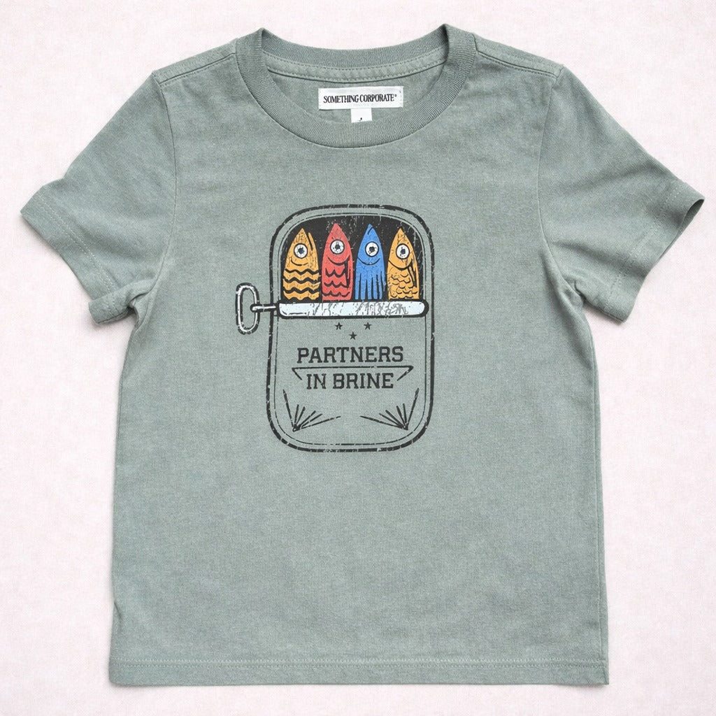T-shirt with colorful fish graphic and 'Partners in Brine' text on a white background