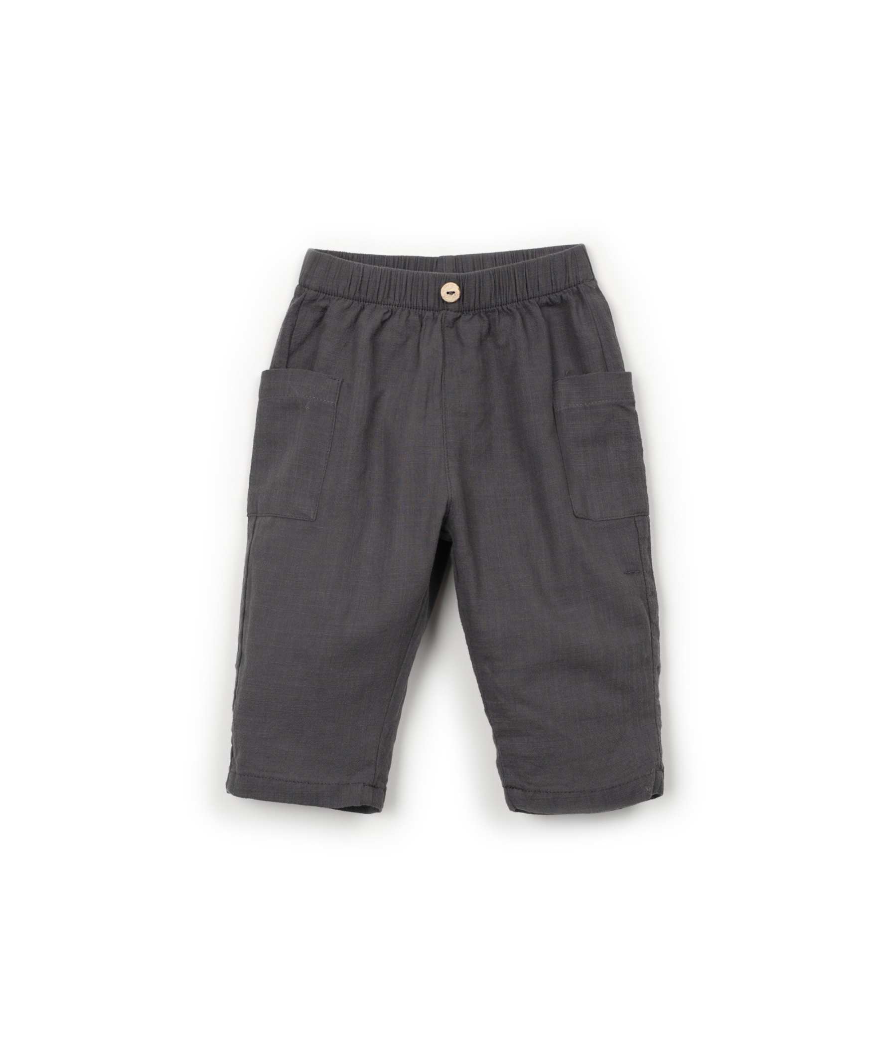 Dark gray trousers with pockets and a button on the waistband