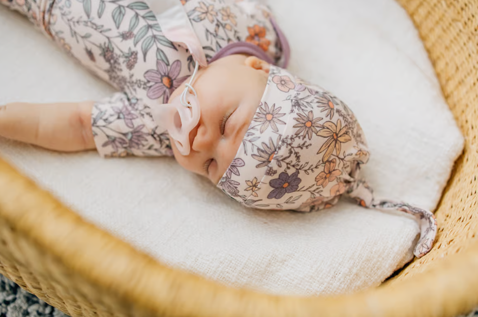 baby knotted hat with purple and pink floral pattern