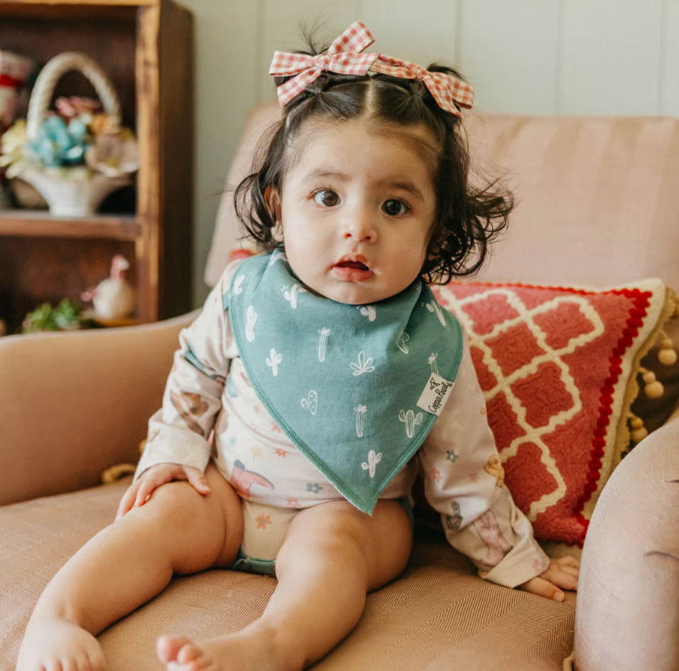 baby wearing cactus print bandana bib