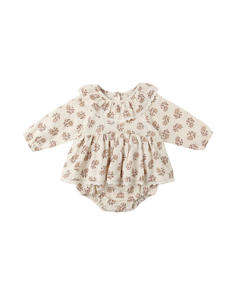 brown floral baby romper with ruffled collar on a white background