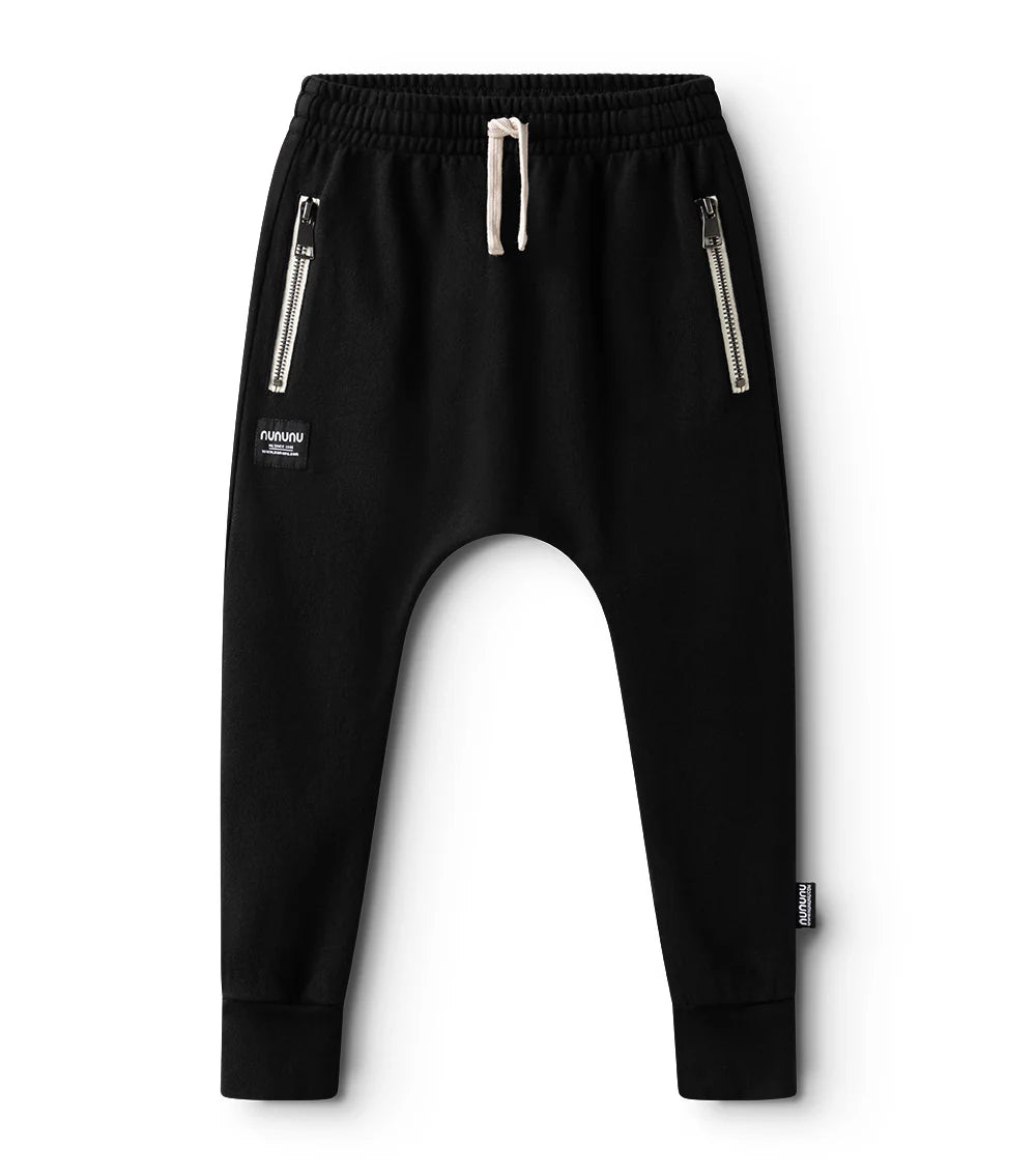 Black harem pants with zippers on a white background