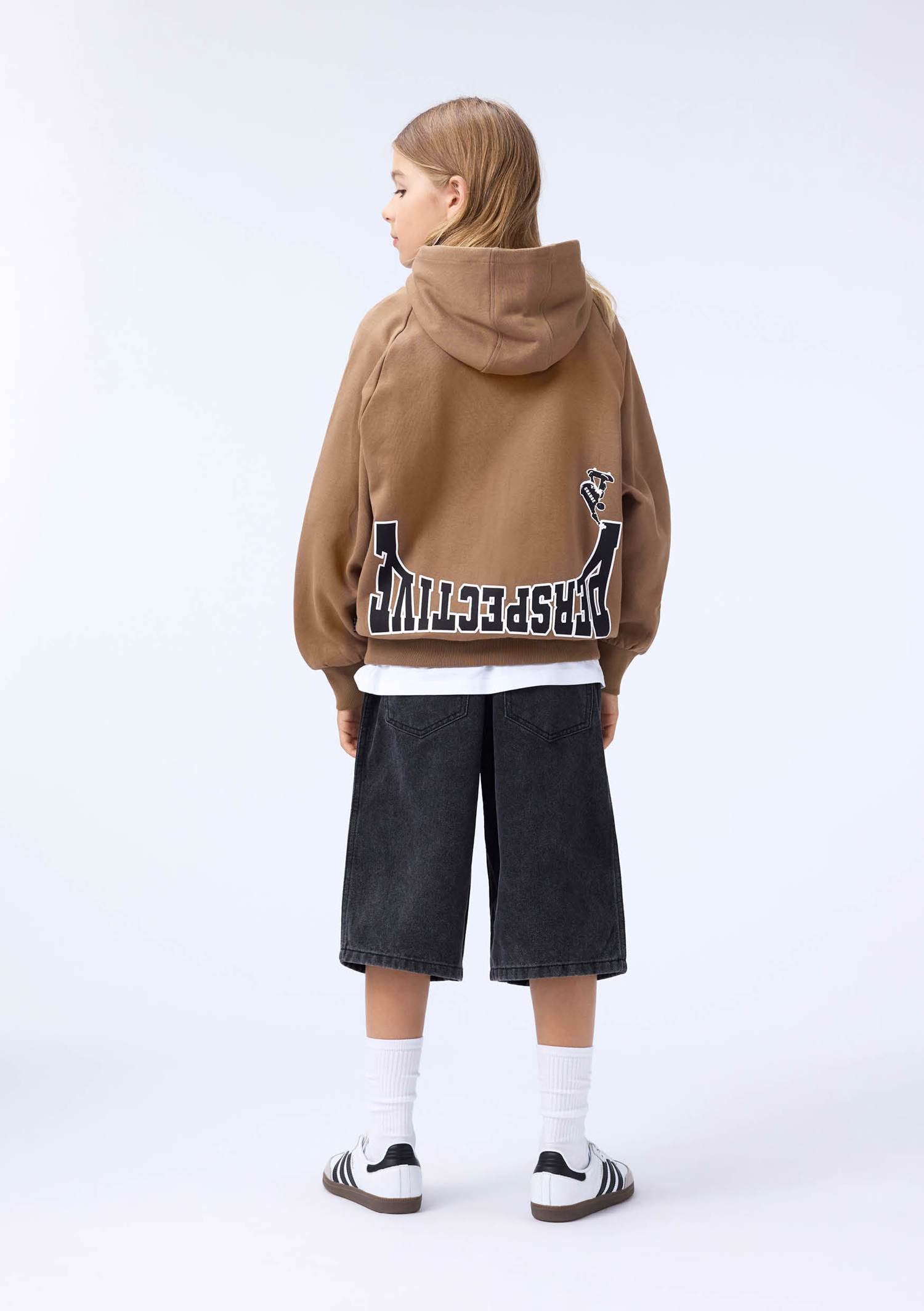 boy wearing brown perspective sweatshirt