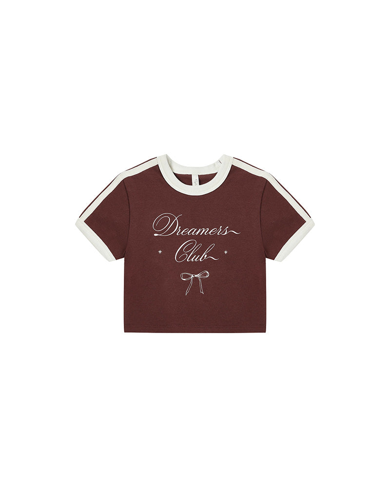 burgundy t-shirt with 'Dreamers Club' text on a white background