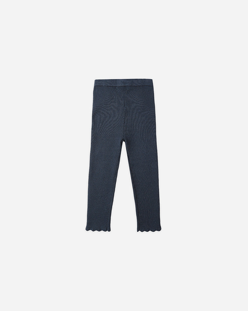 Navy blue leggings on a white background