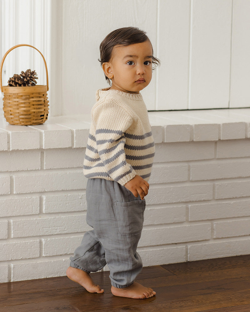 A pair of toddler gray jogger pants featuring an elastic waistband with a drawstring, a three-button placket, and side cargo pockets, shown against a plain white background.