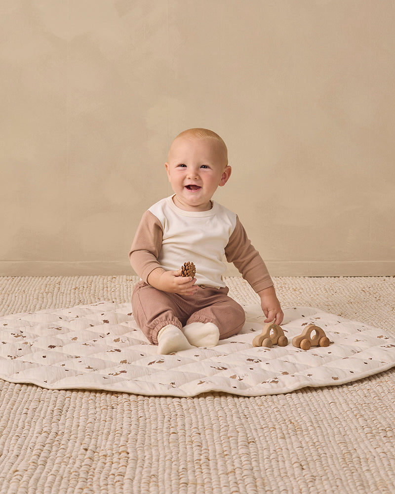 White tee shirt with brown sleeves on a white background
