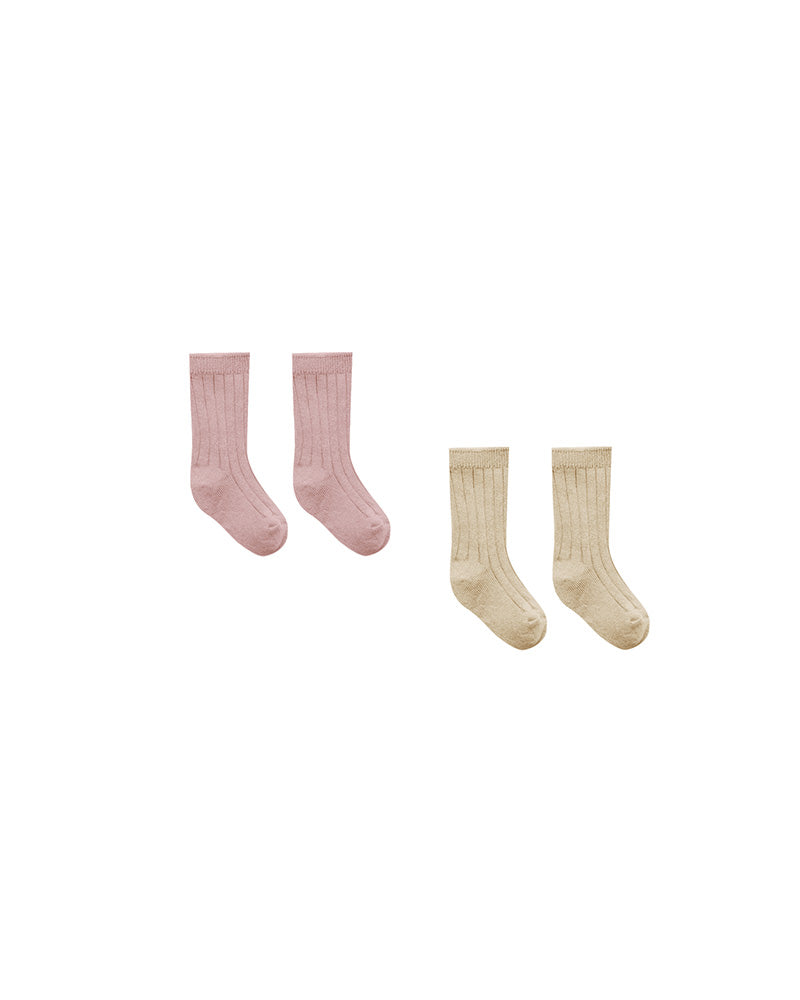 One pair of pink socks and one pair of beige socks on a white background.