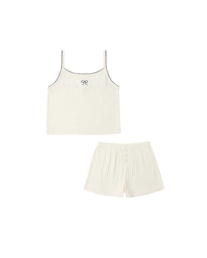 White tank top and shorts set on a white background