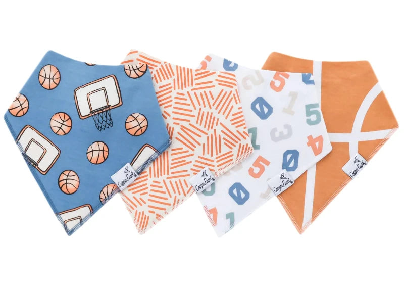 A set of four bandana bibs for babies, with various patterns including basketballs and numbers on a blue, orange, and white background.