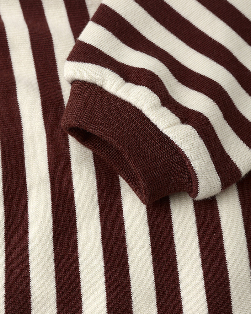 Close-up of burgundy and white striped baby romper