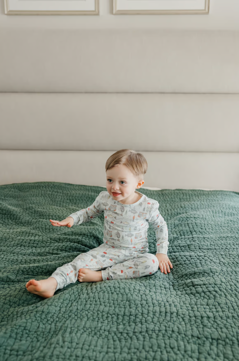 little boy in two piece trout pajama set