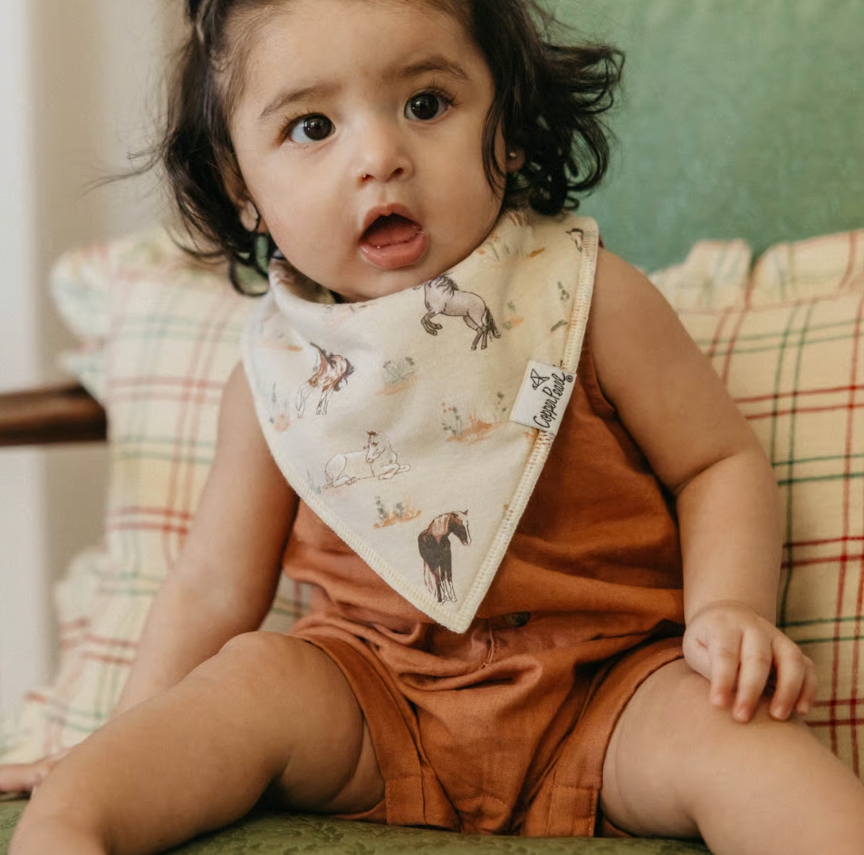 toddler wearing horse print bandana bib