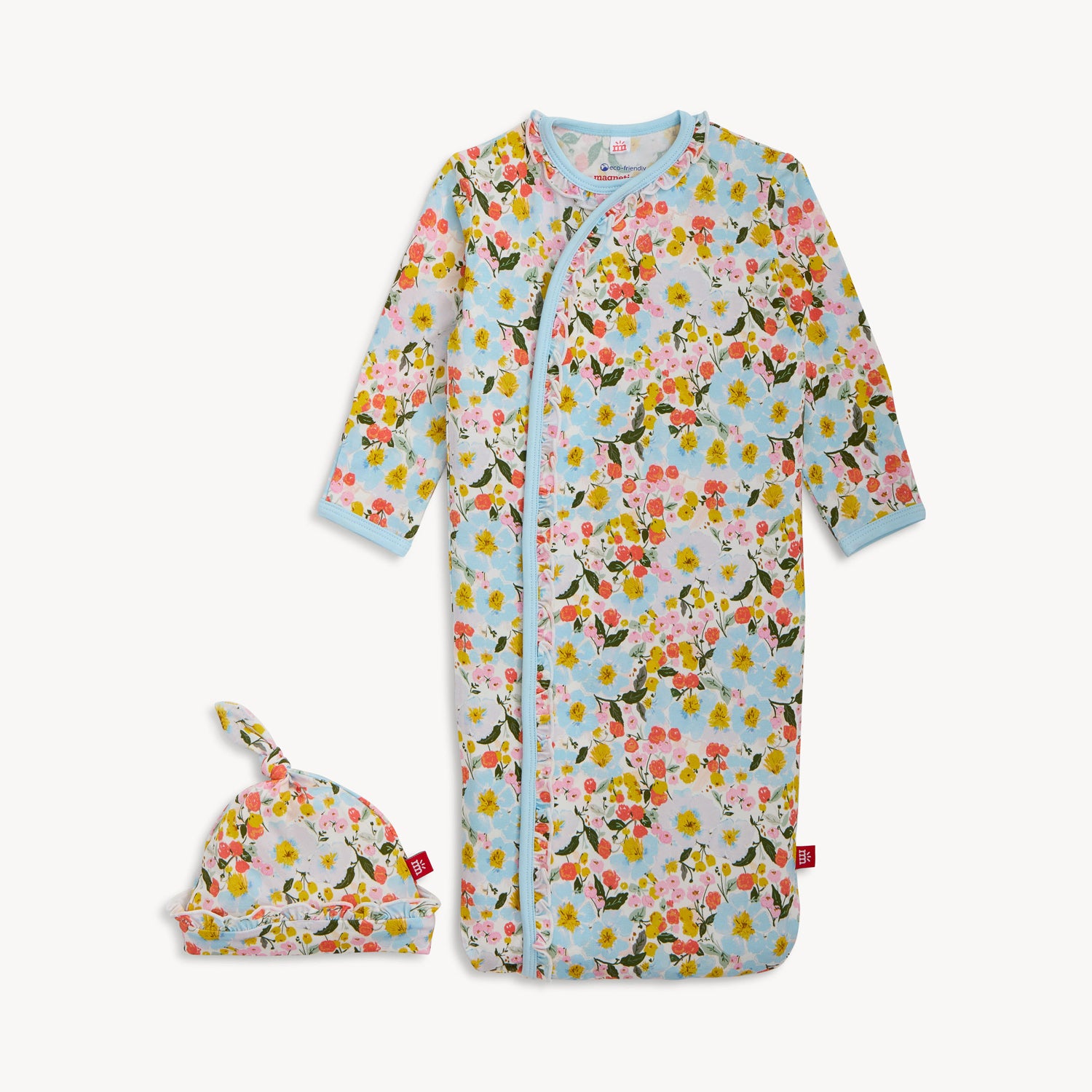 Floral baby onesie and hat set on a white background