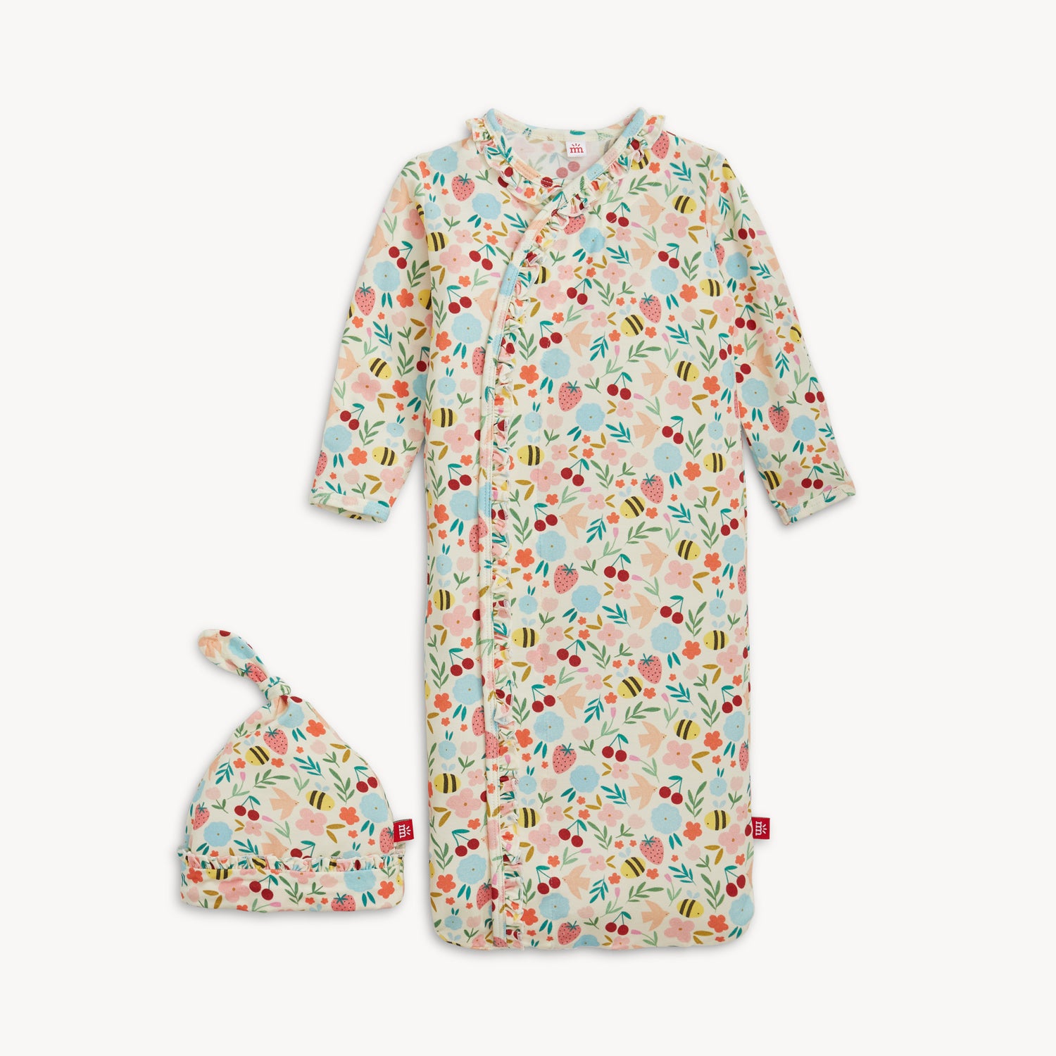Floral-patterned baby onesie and hat set on a white background