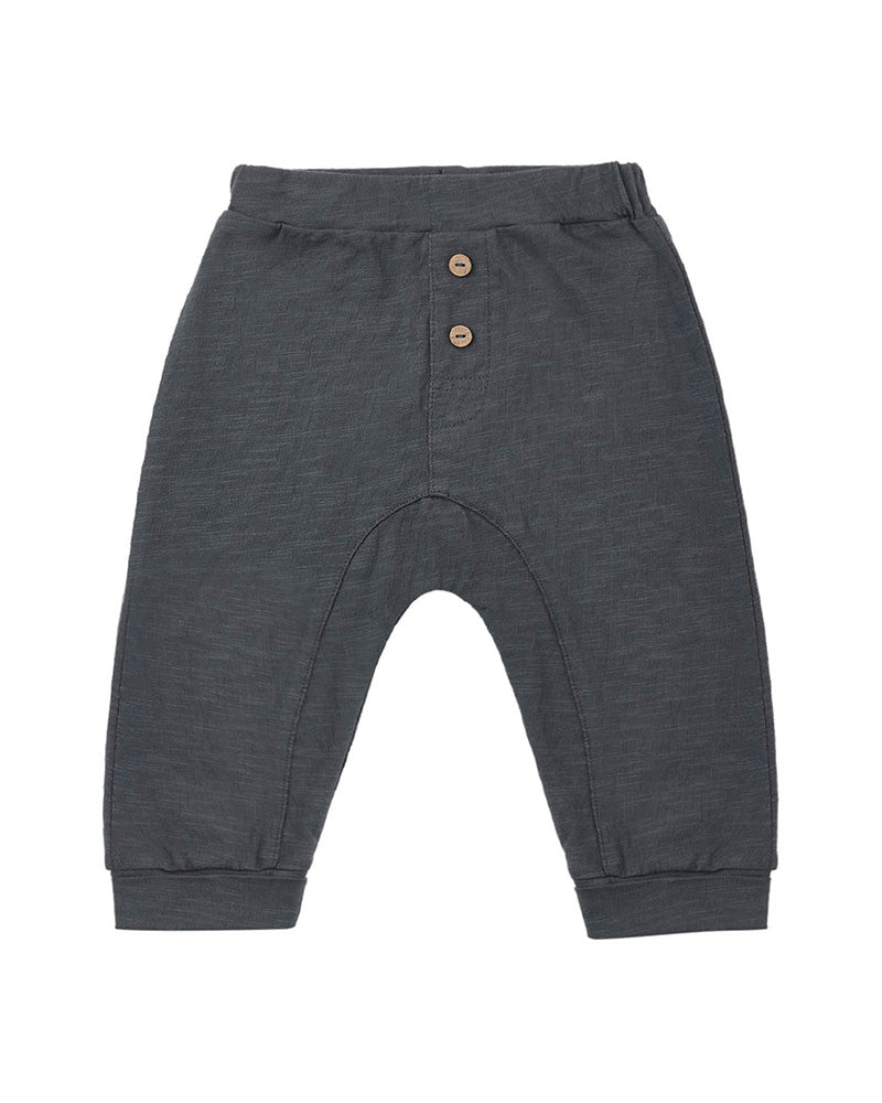 Dark gray baby pants with button details on a white background