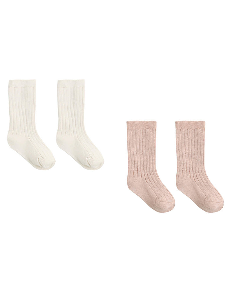 Two pairs of ribbed crew socks on a plain white background, one pair in off-white and the other pair in pale blush pink.