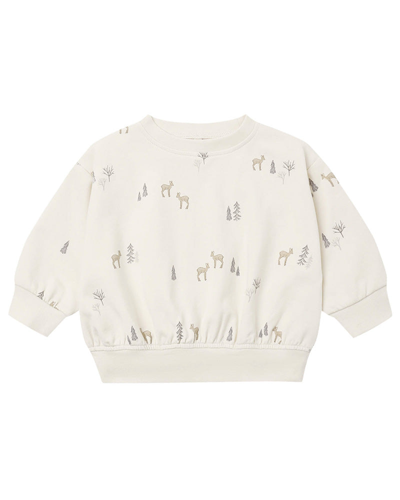 An off-white long-sleeve baby sweatshirt with a repeating pattern of small deer and pine trees in muted gray and beige, shown against a plain white background.