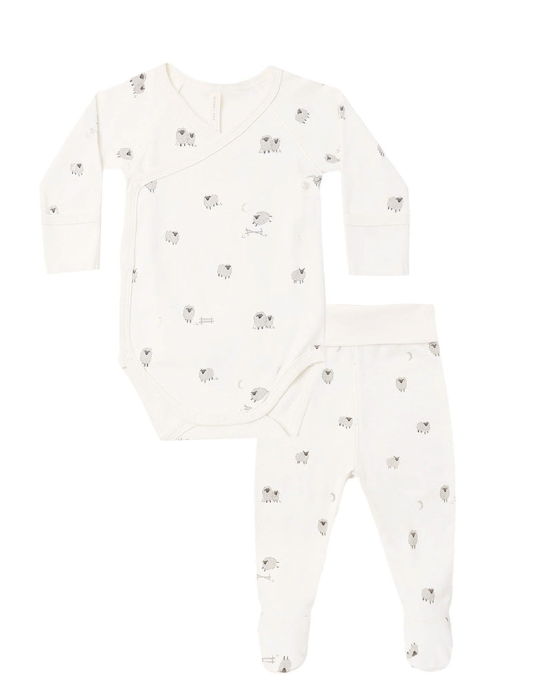 A baby casual set consisting of a long-sleeve bodysuit and matching footed pants in white, both featuring a small gray and black animal print.