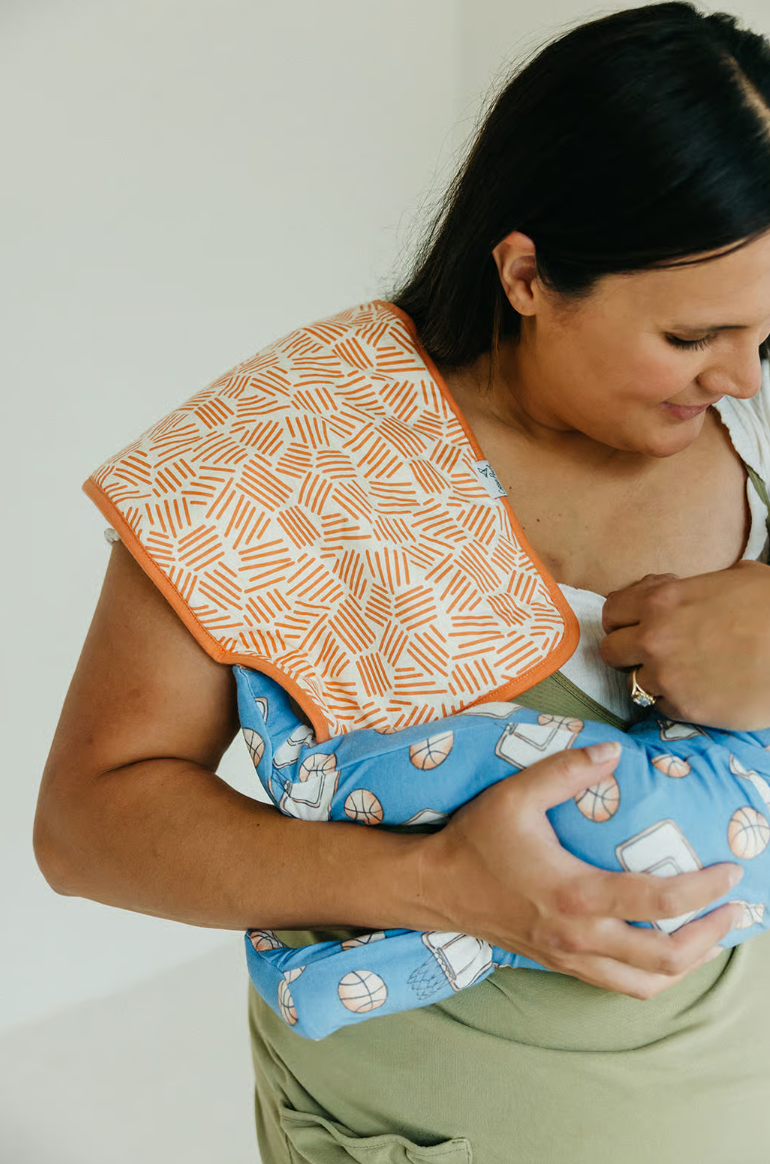 white burp cloth with orange stripes