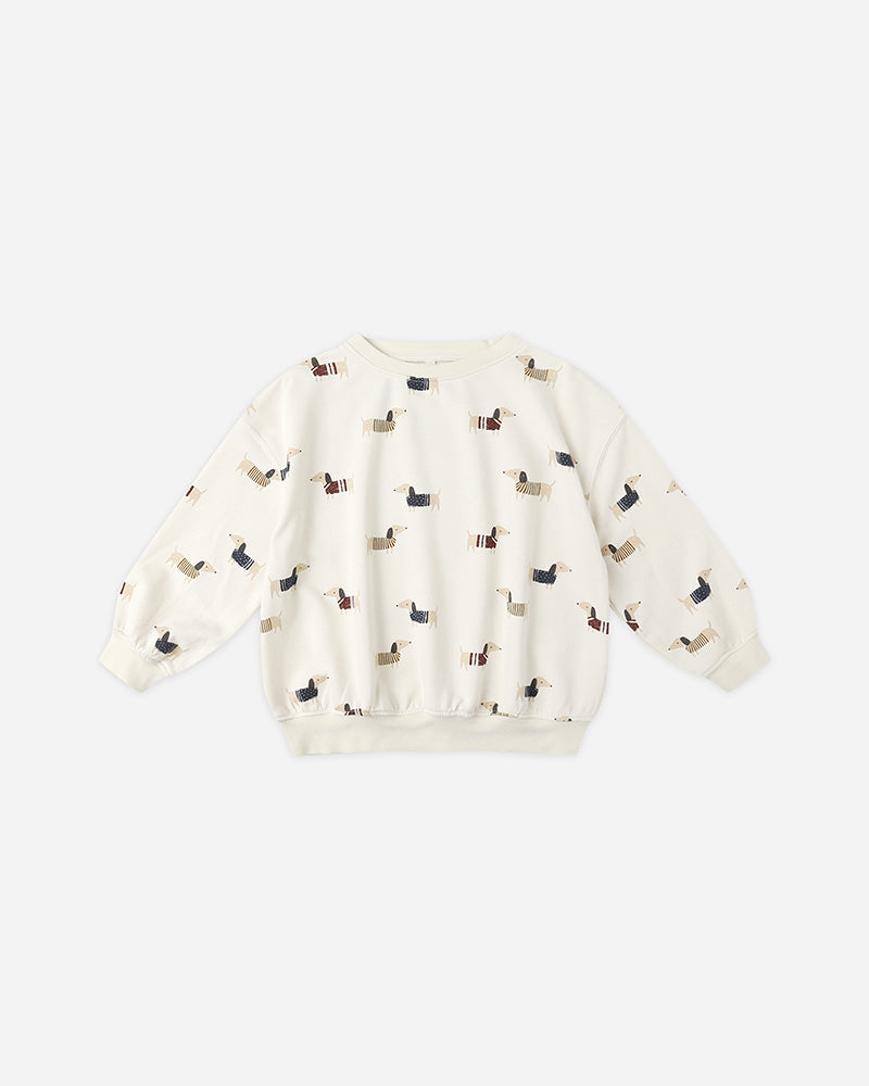 white crewneck with wiener dogs on a white background