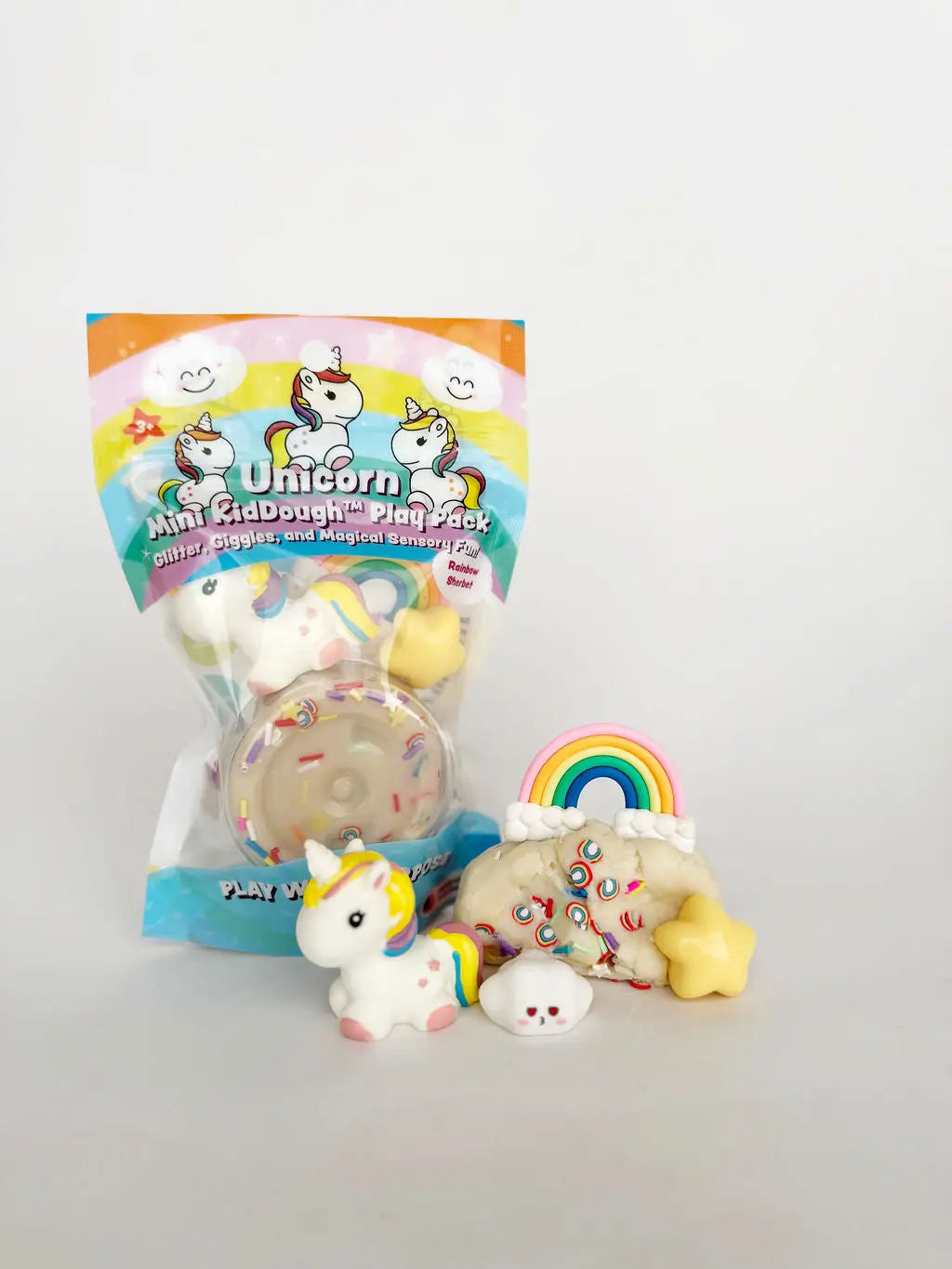 Unicorn-themed play dough set with unicorn, rainbow, and sky figurines