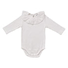 A white ribbed long-sleeve baby bodysuit with a wide ruffled collar, laid flat on a white background.