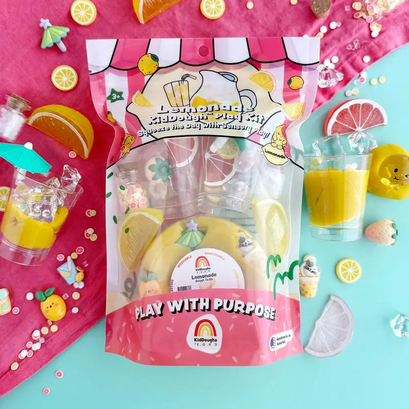 Lemonade Play Dough Kit with lemon accessories and a pink background