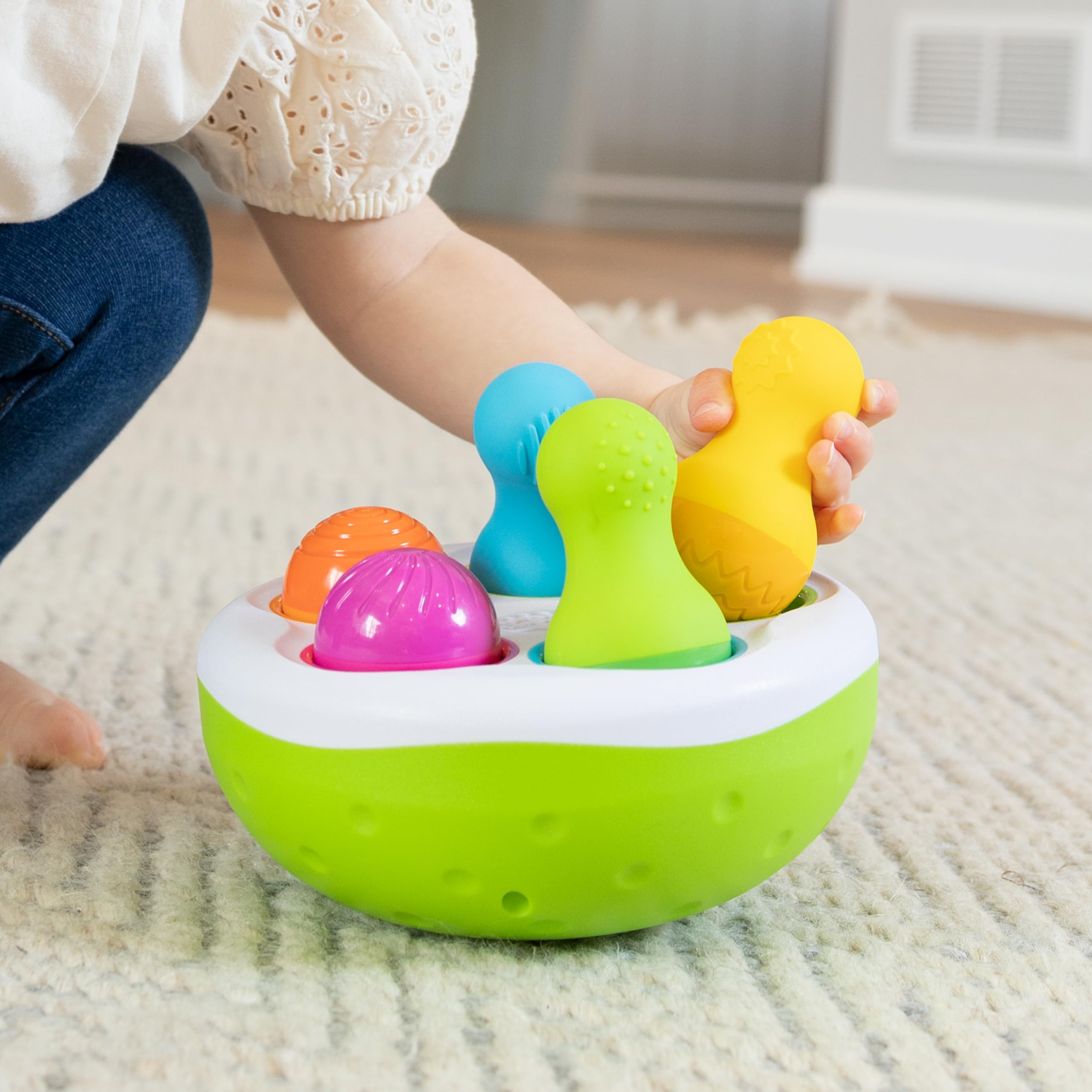 Educational toddler toy SpinnyPins with chunky pins designed for sensory exploration