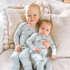 Light blue onesie with a dog pattern and zipper underneath