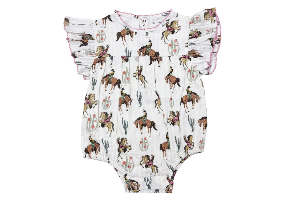 Baby romper with horse and cowgirl pattern on a white background