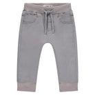 Gray children's pants with a drawstring on a white background