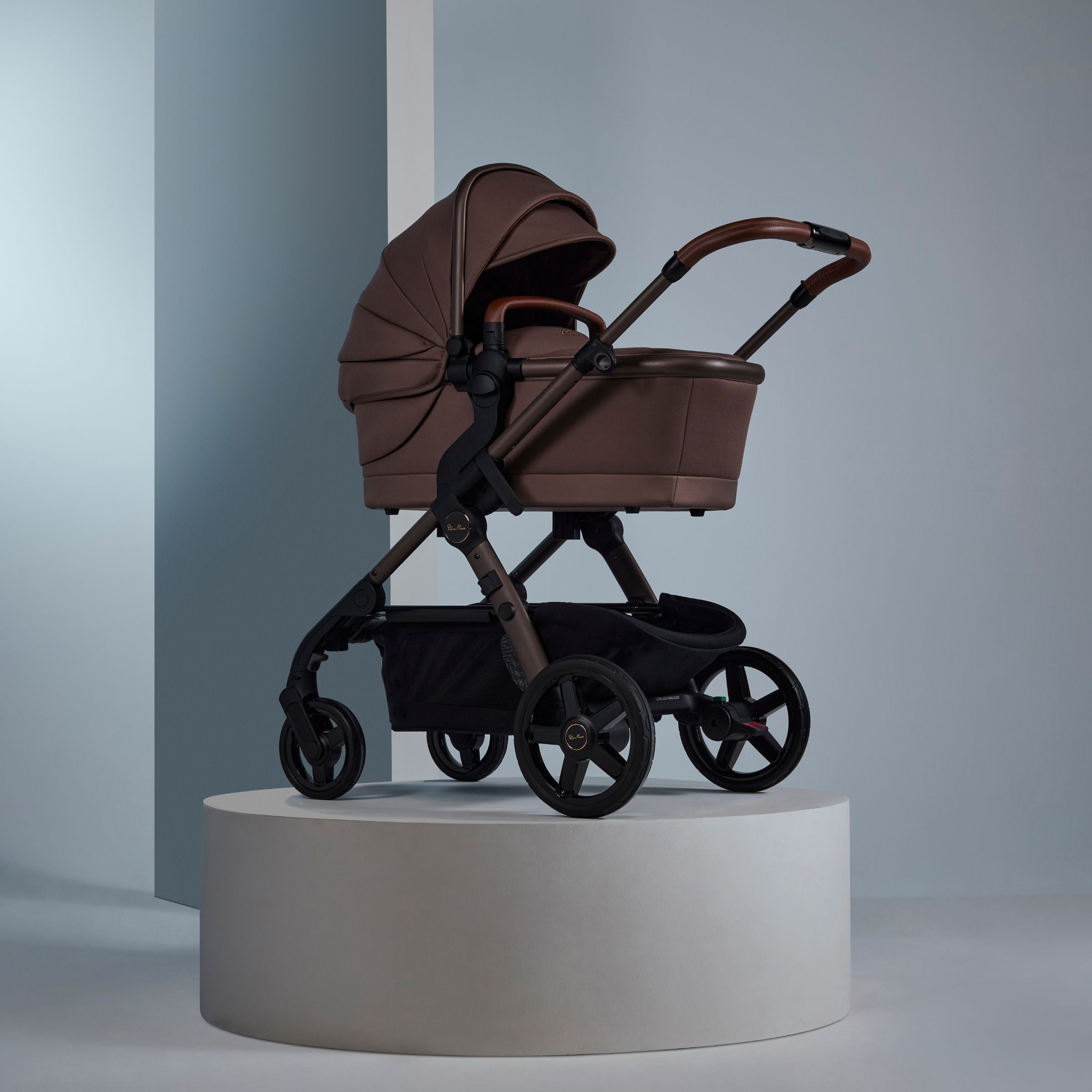 Brown Stroller with tandem seat, infant seat and bassinet