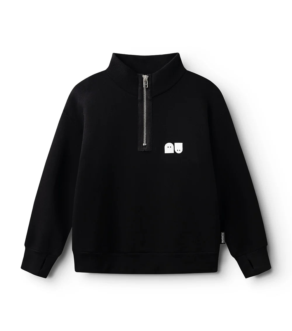 flay lay of black quarter zip long sleeved sweatshirt for child