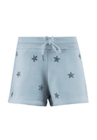 Light blue shorts with star diamond patterns on a white background