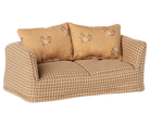 Beige gingham sofa with floral patterned cushions 