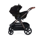 Black stroller with brown accents 