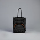 Black rolling Travel Stroller on a gray background