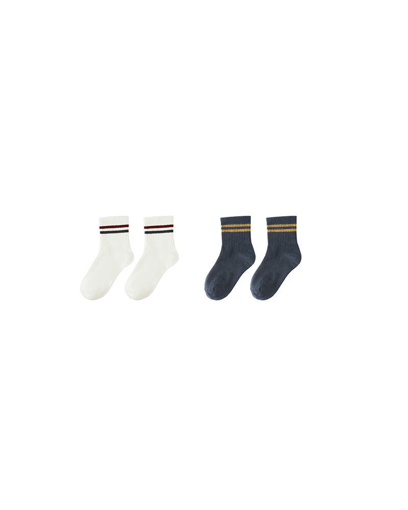 Two pairs of socks, one white and one navy, with stripes 