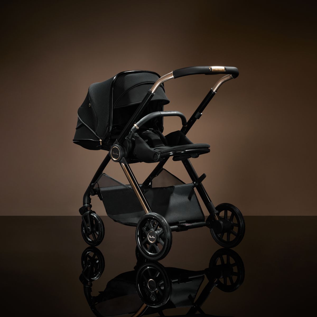 Gold handle and black stroller