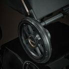 Close-up of a black wheel with a brand logo 