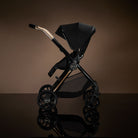Sleek black stroller with rear facing child seat