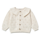 White baby cardigan with button details on a white background