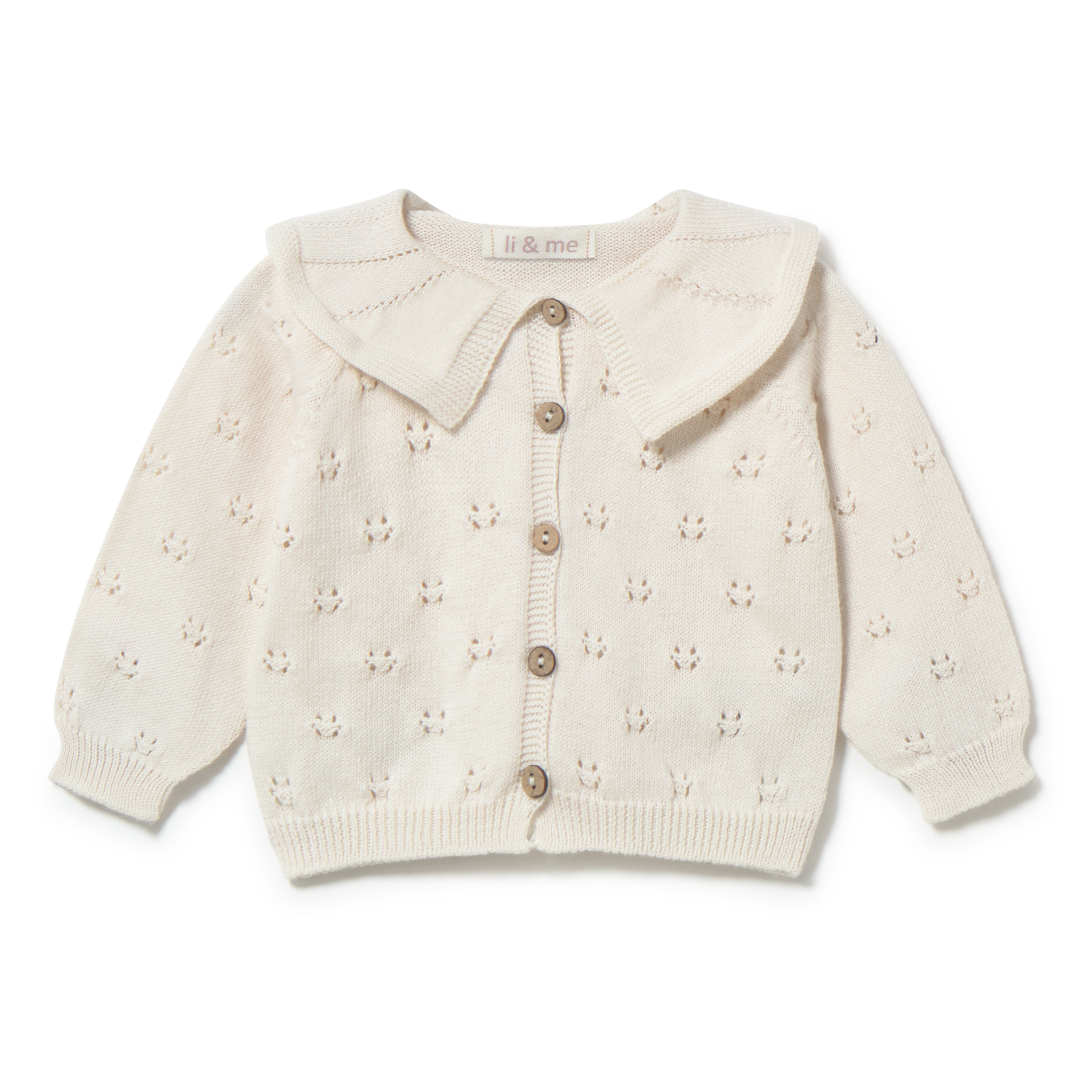 White baby cardigan with button details on a white background