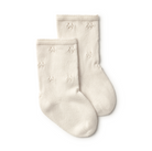Pair of cream-colored socks with star patterns on a white background